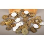 A box of assorted pocket watch movements and dials etc. Spares or repair. No cases.
