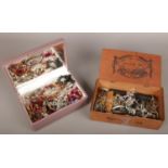 Two boxes of assorted costume jewellery, mainly beads and chains.
