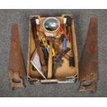 A box of tools to include saws, screwdrivers, chisels etc.