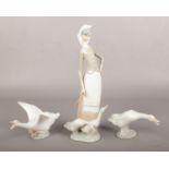 Three Lladro figures, one of a girl with geese and two of geese. Good.