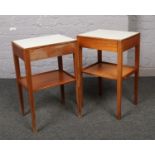 A pair of Remploy teak two tier side tables, with formica tops and single drawer. Broad arrow mark
