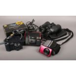 A collection of cameras and a pair of binoculars, to include three digital cameras, Hanimex 35mm and