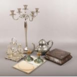 A collection of metalwares, to include candelabra, Crumpsall biscuit tin, simulated pearl necklace