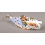 A Royal Crown Derby ceramic figure of an Oceanic Whale, gold stopper. Good.