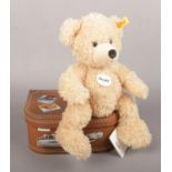 A Steiff Teddy bear Fynn, button on ear in original suitcase (29cm height)
