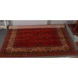 A red ground wool Super Taj carpet, with floral design.(366 x 274cm).