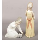 Two Lladro figures of young girls.