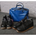 A bag containing two pairs of clogs with tags on, size 9 & size 11