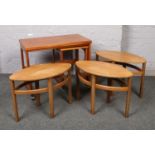 A McIntosh Triform teak nest of tables, along with three teak oval occasional tables. Nest of