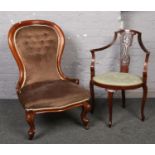 A Victorian mahogany spoonback chair, along with an Edwardian mahogany salon chair.