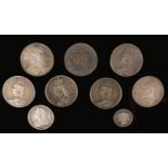 Victorian silver coins; seven crowns, half crown and one shilling.