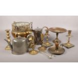 A collection of metalwares, to include brass candlesticks, pewter teapot, silver plate water pot