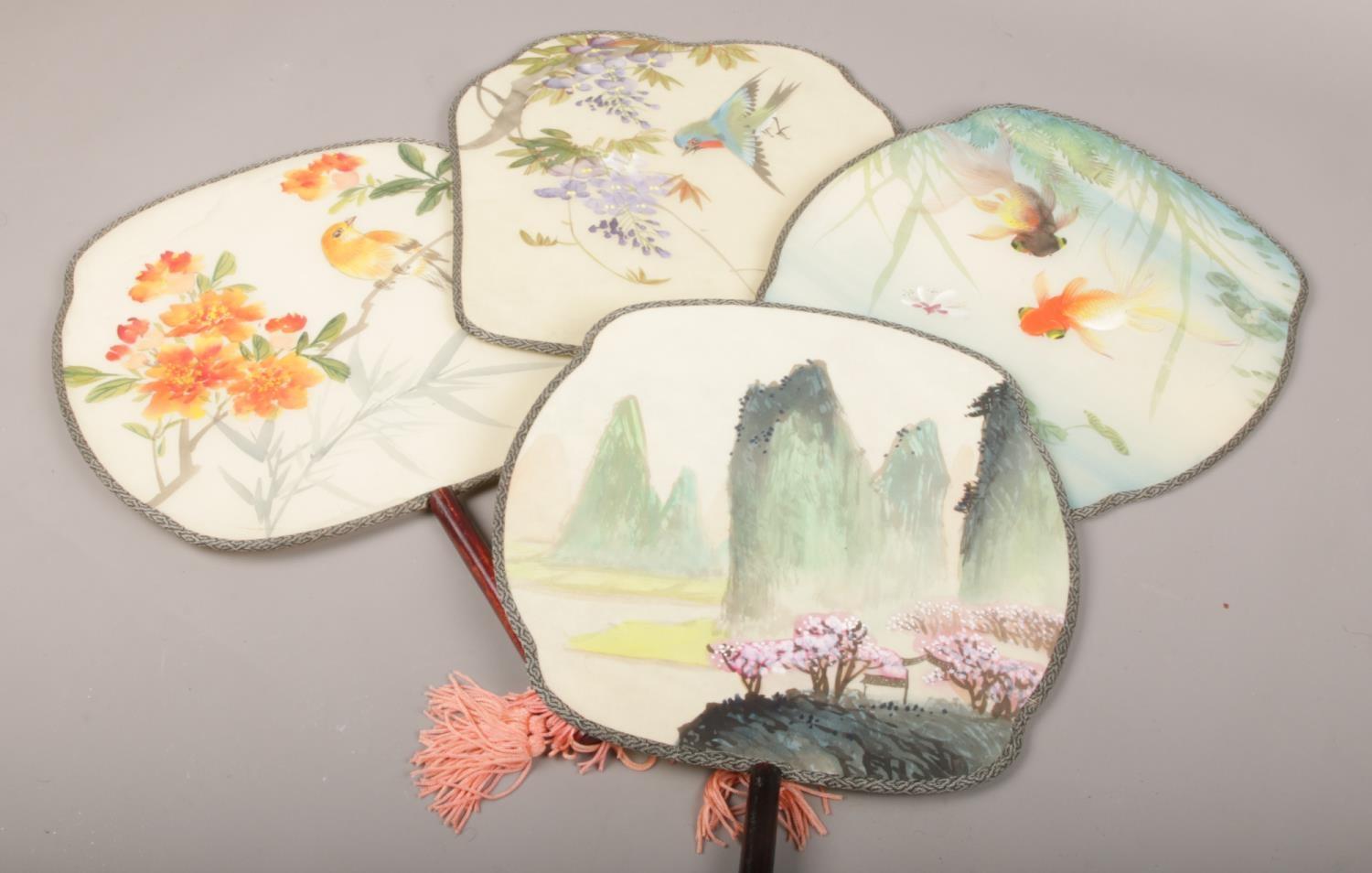 A collection of oriental decorative double sided hand fans