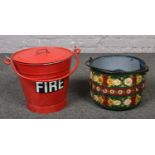 A red painted fire bucket, along with a barge ware example.