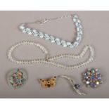 A box of 1950s and later costume jewellery, two necklets and four brooches.