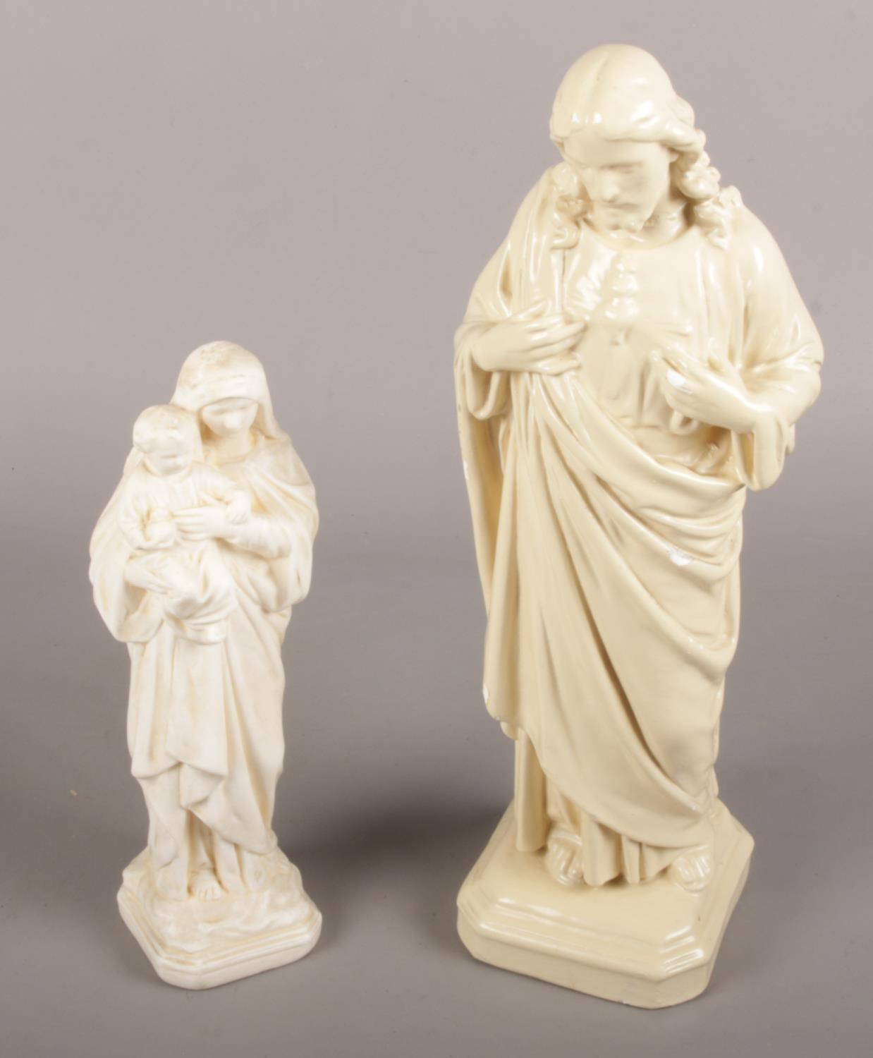 Two vintage religious plaster figures including Christ with sacred heart.