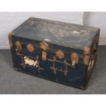 A large vintage metal bound travel trunk (91cm wide x 53cm height)