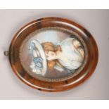 An early c20th faux tortoise shell framed miniature painting of a maiden.