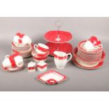 A Crownford Burslem ceramic tea set, with red/white spot design, cups, saucers, side plates, milk