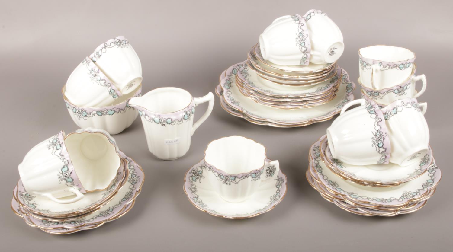 A Wellington China J.H.C & Co ceramic tea set, lilac/blue design tea cups, saucers, side plates,