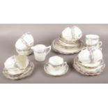 A Wellington China J.H.C & Co ceramic tea set, lilac/blue design tea cups, saucers, side plates,