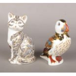 Two Royal Crown Derby paperweights, Majestic Cat 352/3500 and Puffin.