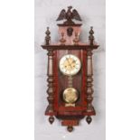 An early 20th century mahogany cased 8 day time and strike wall clock. Working.