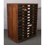 A large twelve drawer plan chest. (135 x 101 x 65cm). Drawers open and close easily. Knocks and