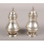 A pair of Victorian silver sugar casters, Assayed London 1896 by Charles Stuart Harris.