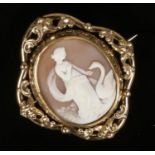 A Victorian pinchbeck shell cameo swivel brooch. Carved to depict Leda and the Swan.