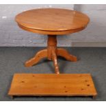 A Pine extending dining table (approx 89 cm height 107 cm wide) and four pine carved dining tables (