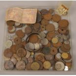 A tray of mixed 20th century coins. British pre-decimal, Commonwealth and world. Along with a silver