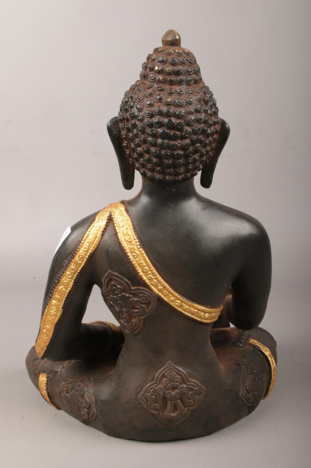 A metal seated medicine Buddha with gilt decoration. (Height 29cm). Good. - Image 2 of 3