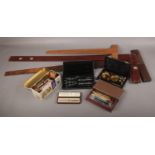 A collection of drawing equipment, to include draughtsman's squares, pen nibs, cased scales etc.