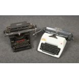 A Remington Rand typewrite, along with an Olympia example.