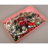 A tray of costume jewellery to include beads, bangles, necklaces, rings, etc.