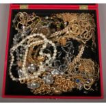 A box of assorted costume and dress jewellery including simulated pearls and gilt pieces etc.
