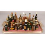 A tray of alcohol miniatures to include stoneware bottle examples etc.