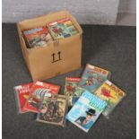 A box of children's annuals, to include Dick Barton, Kojak, Hurricane etc.