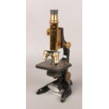 A 19th century Ernst Leitz Weltzar lacquered brass microscope No. 239427.