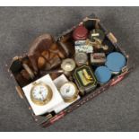 A box of miscellaneous collectables including vintage advertising tins, ships quartz clock and
