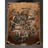 A box of horse tack to include irons etc.