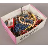 A box of costume jewellery to include beads, bangles, necklaces, rings, etc.