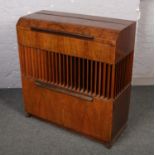 A bur walnut cased Decoli Dulci radiogram with Garrard turntable.