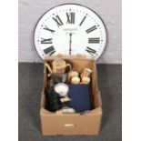 A box of miscellaneous to include large wall clock, Wedgwood willow pattern, boxed cabinet plates,