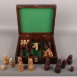 A reproduction Isle of Lewis chess piece set in wooden box (full set)