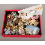 A box of costume jewellery mainly brooches, rings earrings etc