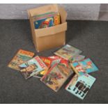 A box of children's annuals, to include Biggles, Express, Lion etc.
