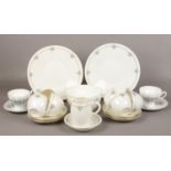 A 1920s Shelley China six place teaset printed and enameled with stylized borders along with a later