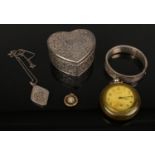 A collection of jewellery, silver floral engraved bangle, silver locket pendent and chain, Ingersoll